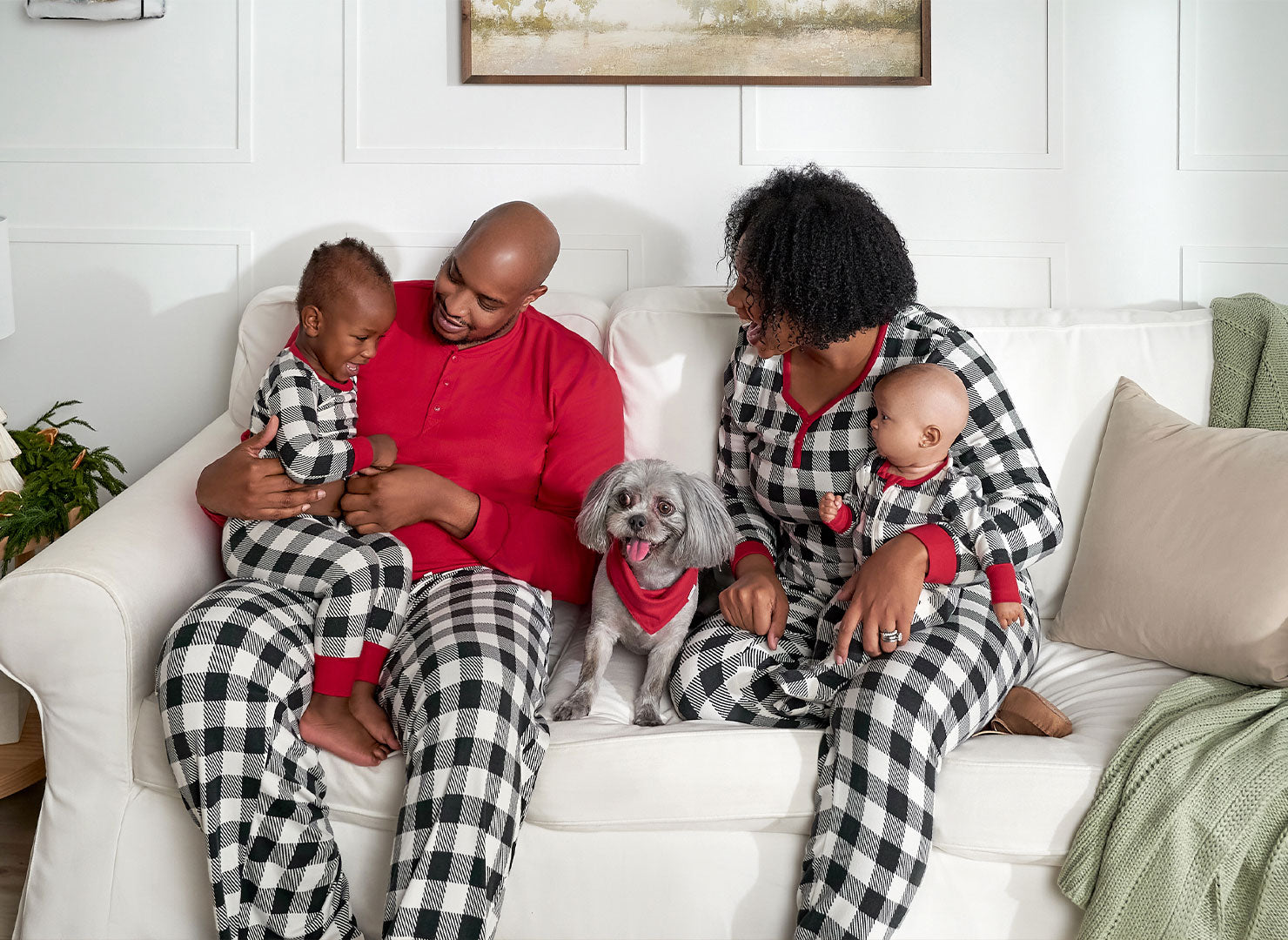 Merry and bright family in cozy Christmas jammies, ready for a night of holiday fun.